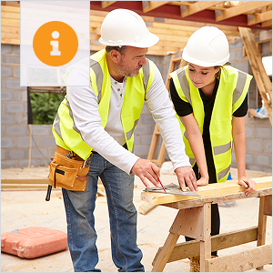 Female apprentice working on building site